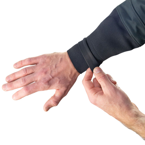 Person wearing a dry suit showing a neoprene gasket under a neoprene wrist cuff